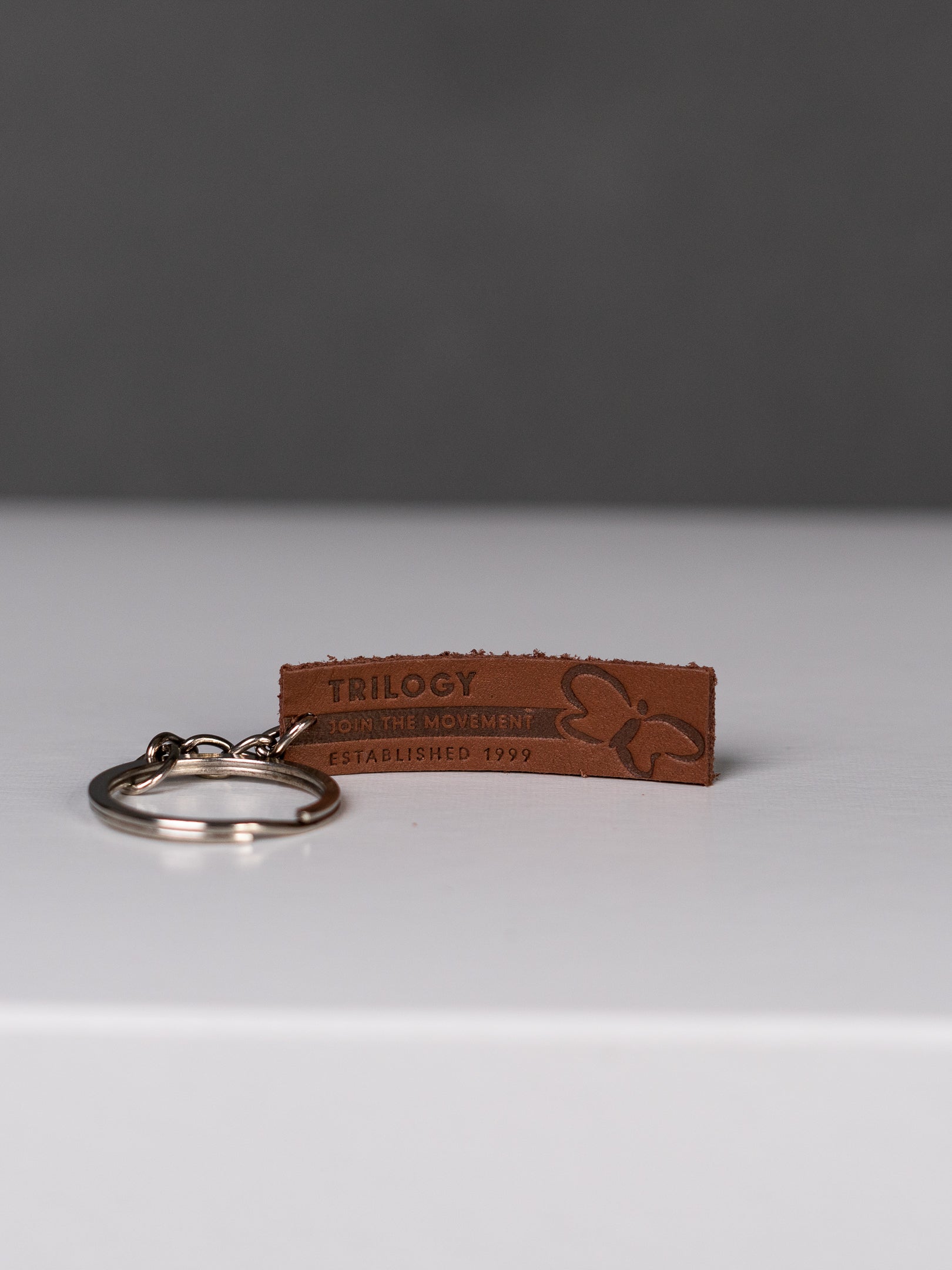 Live Happier Leather Key Chain – #MyTrilogyLife Shop